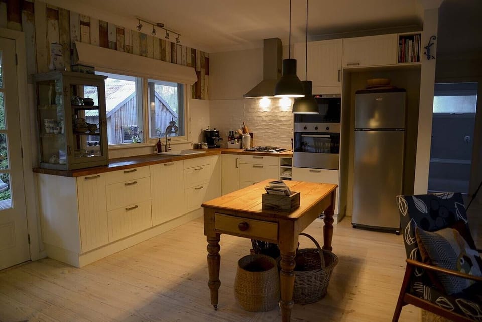 Open kitchen stocked with essential oils and cooking equipment