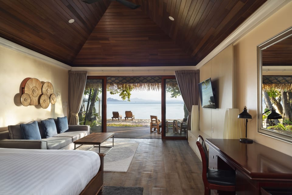 Luxury Beachfront Villa | Living area | 50-inch Smart TV with cable channels, TV, Netflix