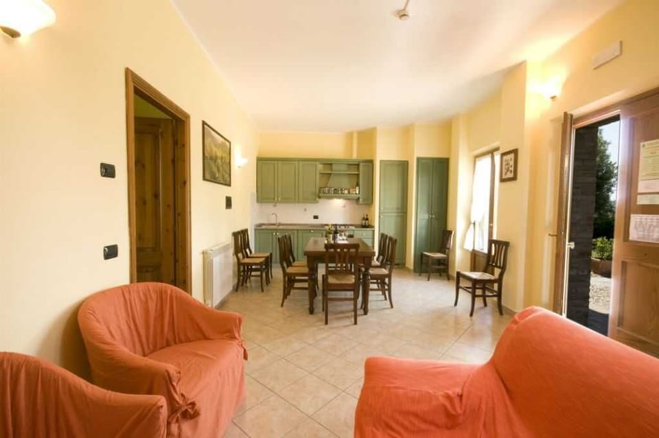 Apartment, 5 Bedrooms (Rosmarino) | Living room | Flat-screen TV