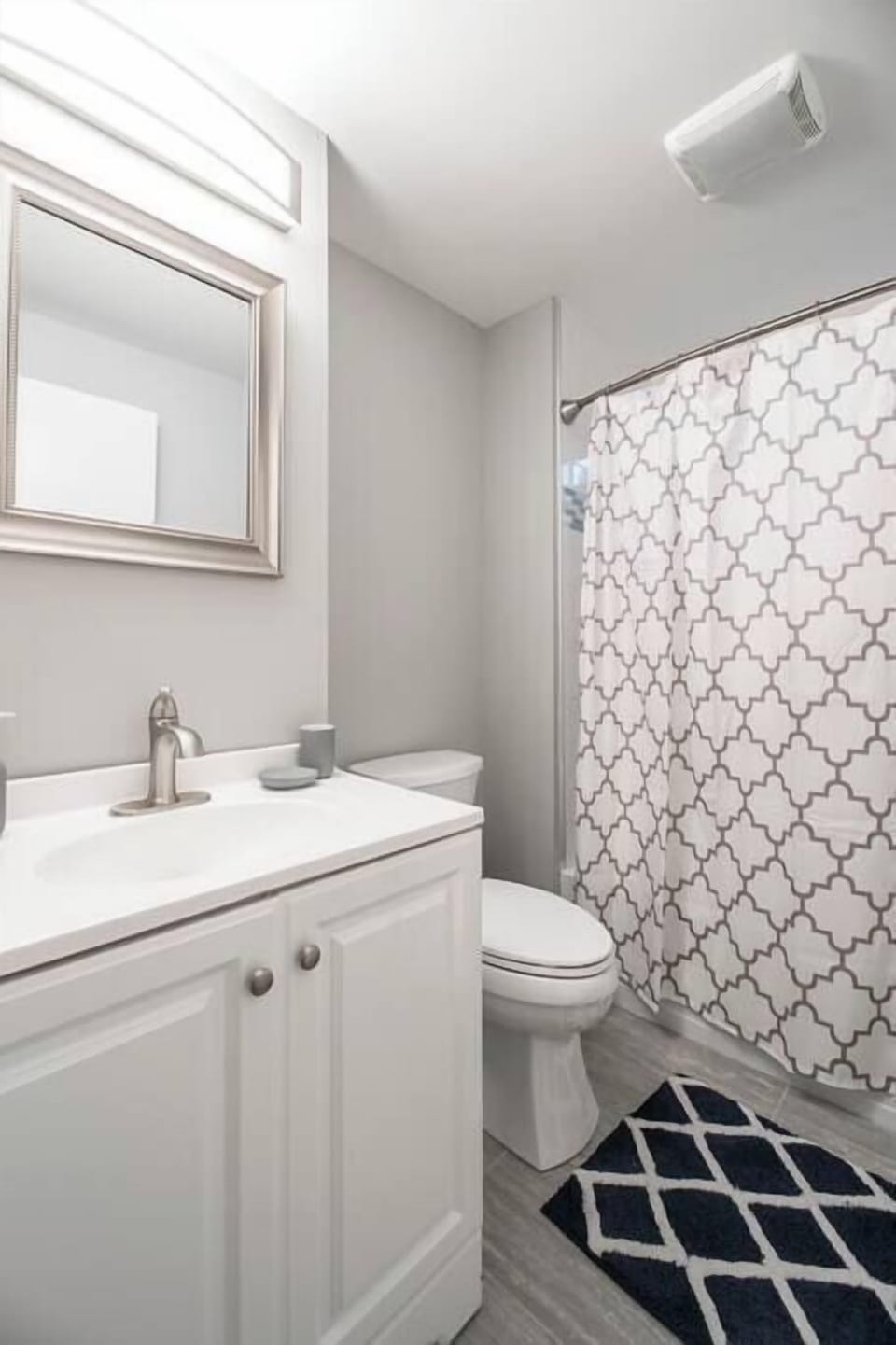 Freshen up in
the main-level
bathroom, kept
clean and
simple with a
tub/shower
combo and
fresh modern
finishes.
