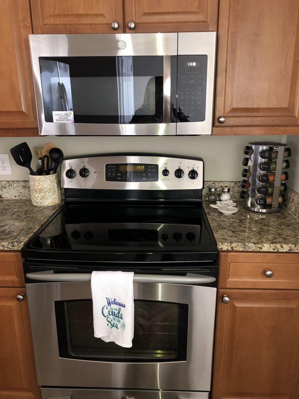 Brand new stainless appliances and plenty of cookware.
