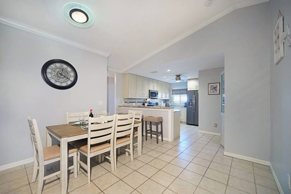 The dining area is between the kitchen and the living room