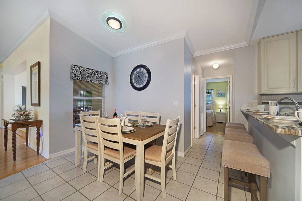 The dining area is off the kitchen and has room for 6