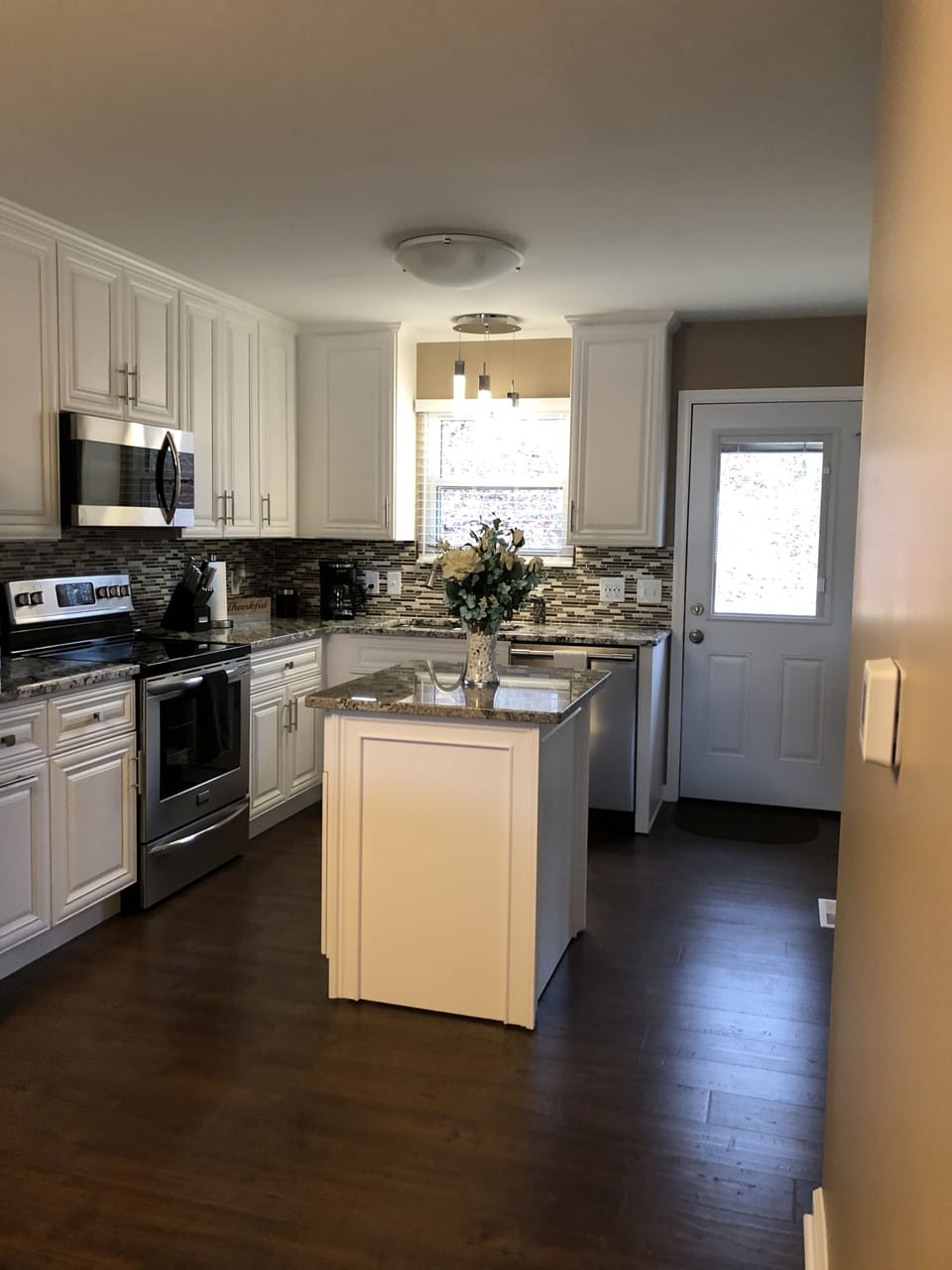 Kitchen leading to the back deck