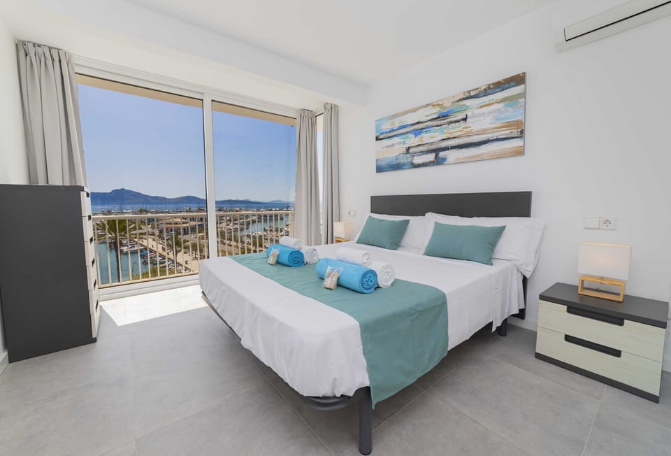 Bright master bedroom with double bed and natural light