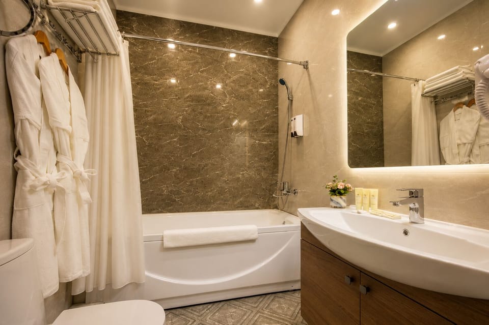 Rainfall showerhead, hair dryer, slippers, towels