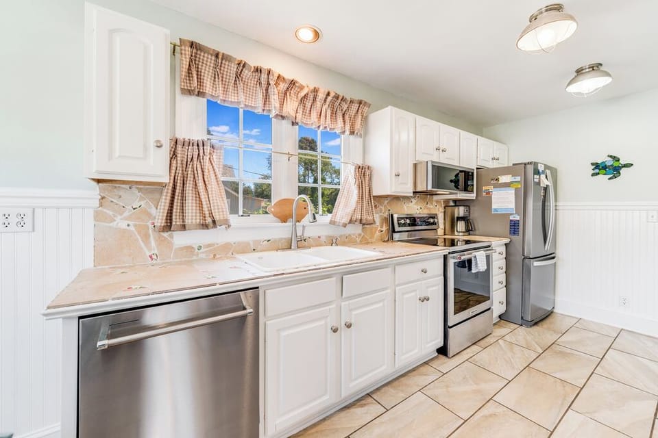 Truly unique with a Custom Back Splash created with Stone & Sea Glass.