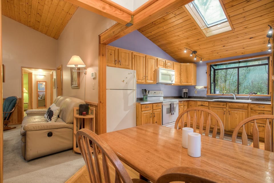 Sky lights and an open plan between kitchen and living make this feel quite spacious and bright!