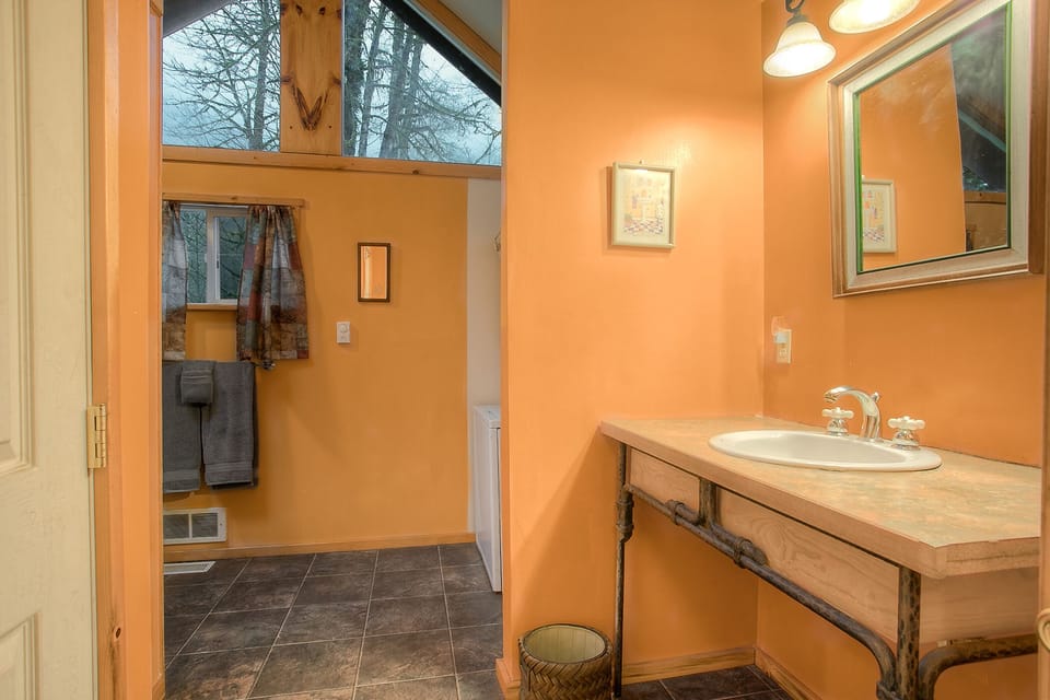 Across from the first bedroom is the large bathroom