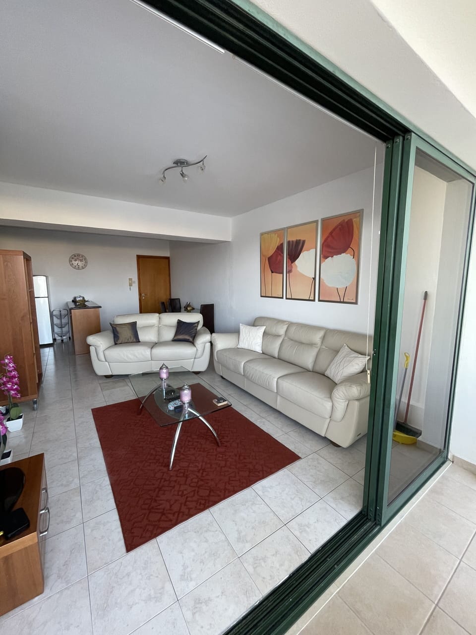 Design Apartment, Pool View | Living area | Flat-screen TV
