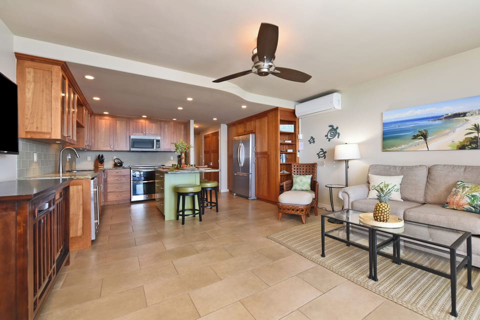 A clean, well‑appointed kitchen with stainless‑steel appliances and warm wood cabinetry, ideal for effortless vacation cooking.