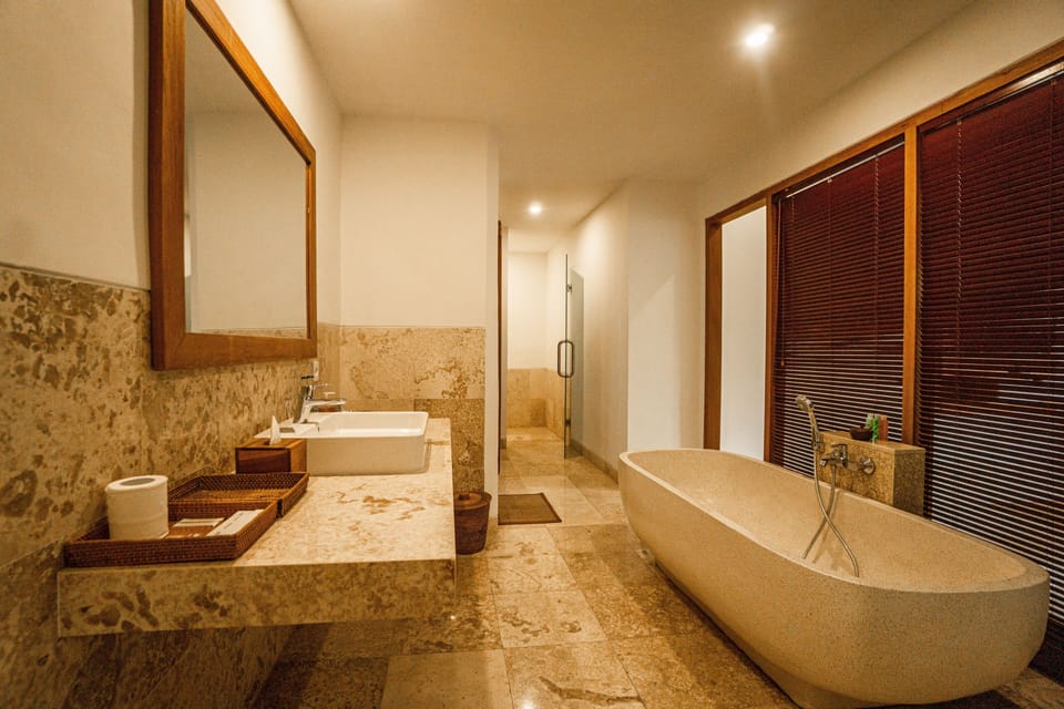 Separate tub and shower, rainfall showerhead, free toiletries