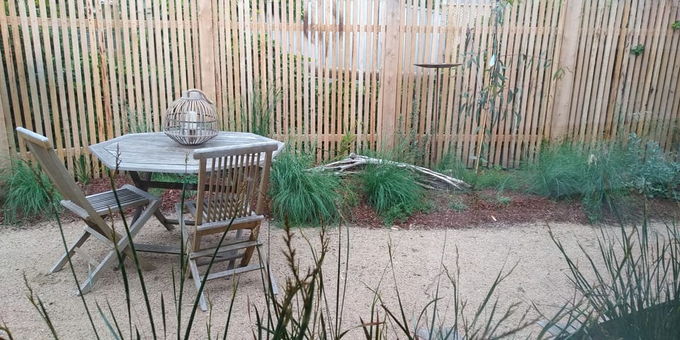 Private native garden viewed from kitchen/dining area.