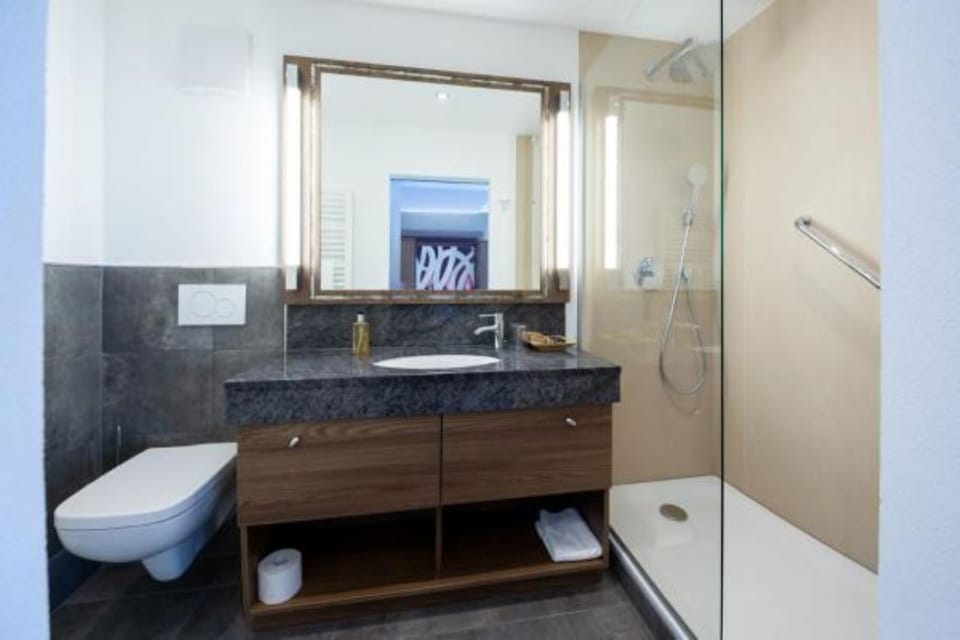 Shower, free toiletries, hair dryer, slippers