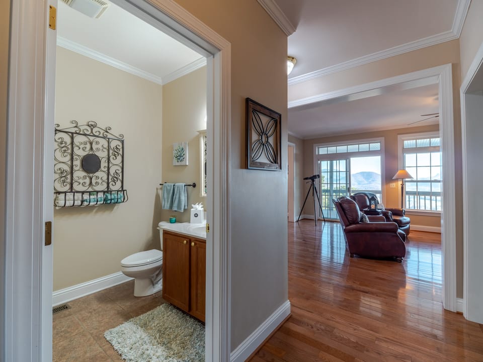 Powder room with laundry area with bifold doors