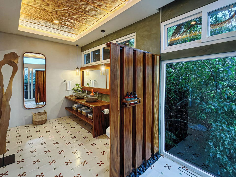 Quetzal Suite | Bathroom | Shower, rainfall showerhead, designer toiletries, hair dryer
