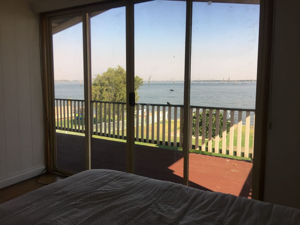 Master Bedroom with King Size bed and TVs and WATERVIEW