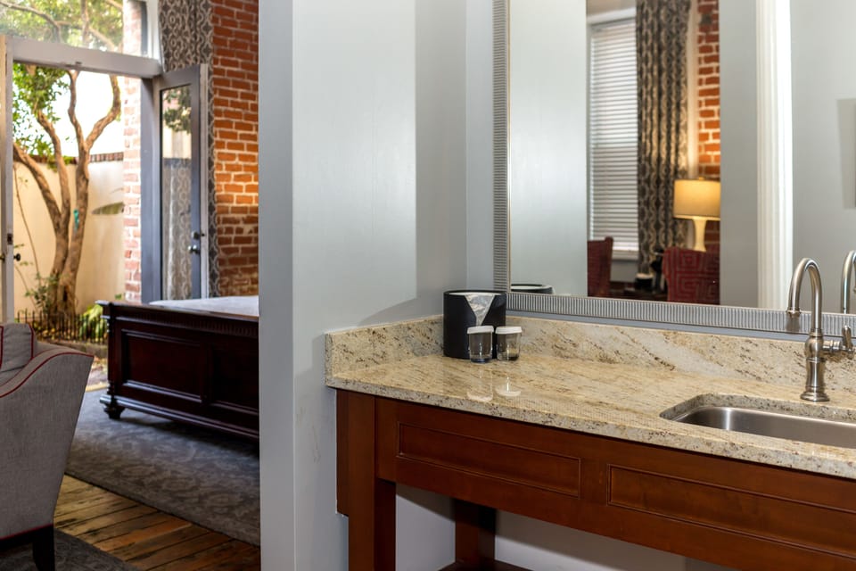 Suite, 1 King Bed, Patio | Living room | Flat-screen TV