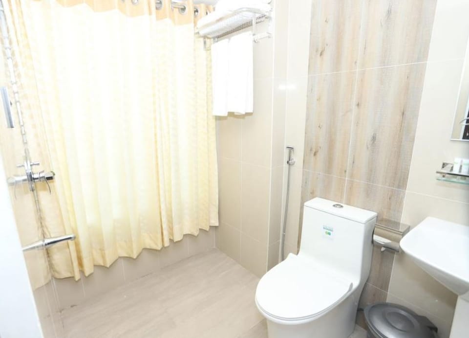 Shower, rainfall showerhead, slippers, towels