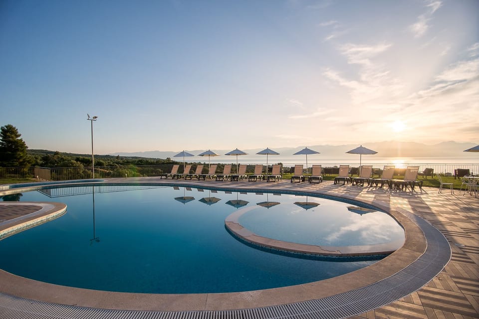 Outdoor pool, open 8:30 AM to 8:30 PM, pool umbrellas, sun loungers