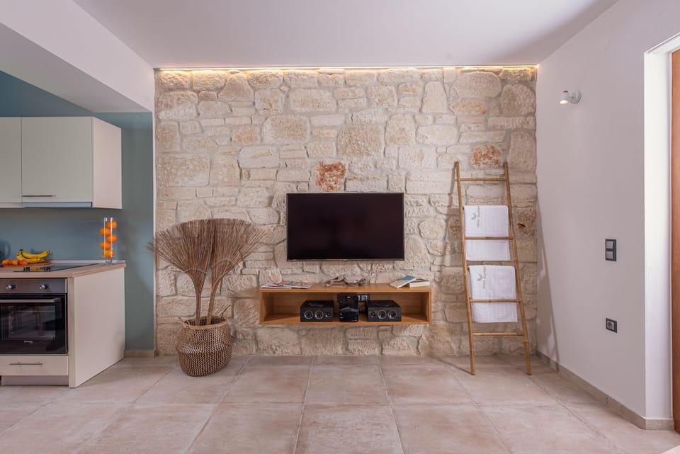 Junior Suite, Sea View | Living area | 50-inch flat-screen TV with cable channels, TV