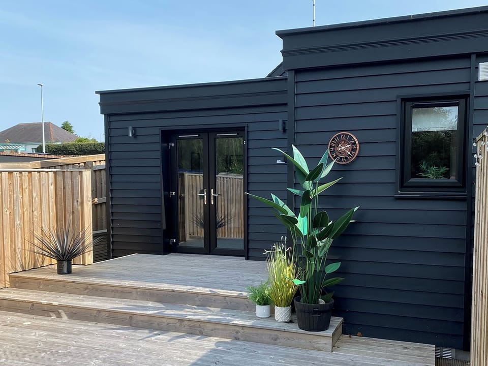 Secluded decking area to the rear of the cottage | Mile End Cottage, Inverness