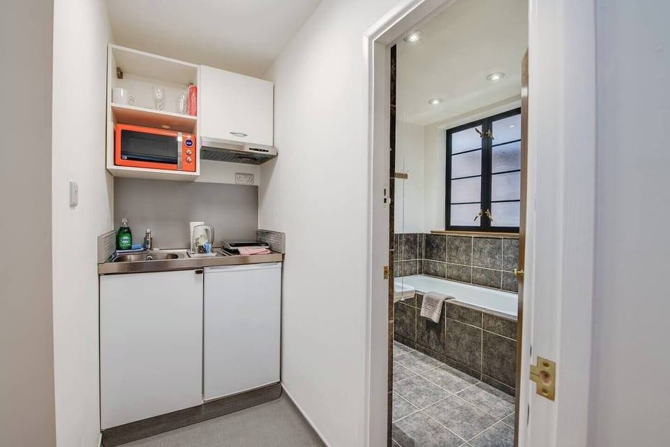 Kitchenette: Bright and functional space for culinary adventures before exploring Portsmouth!