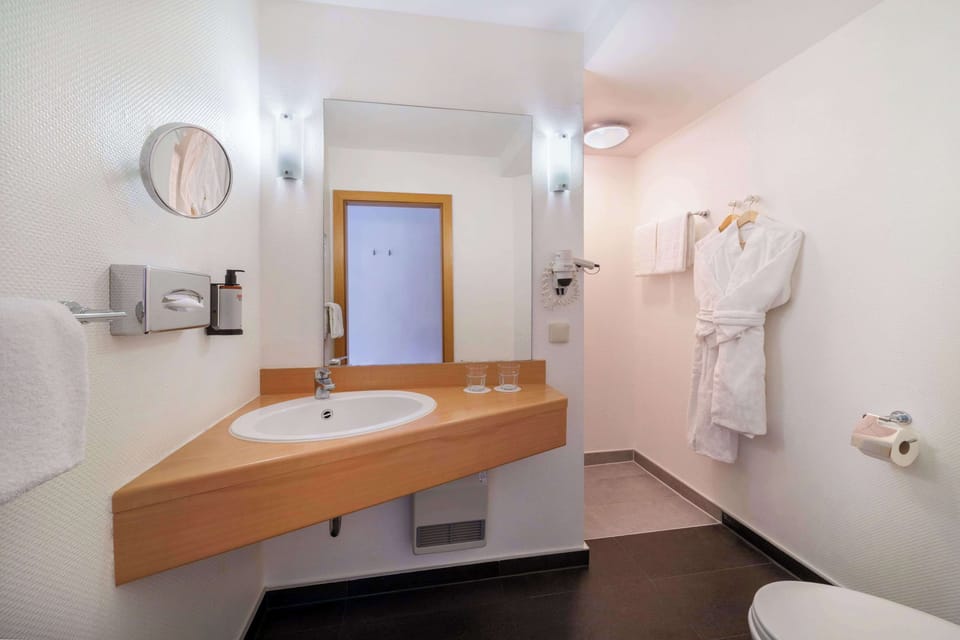Shower, rainfall showerhead, hair dryer, towels