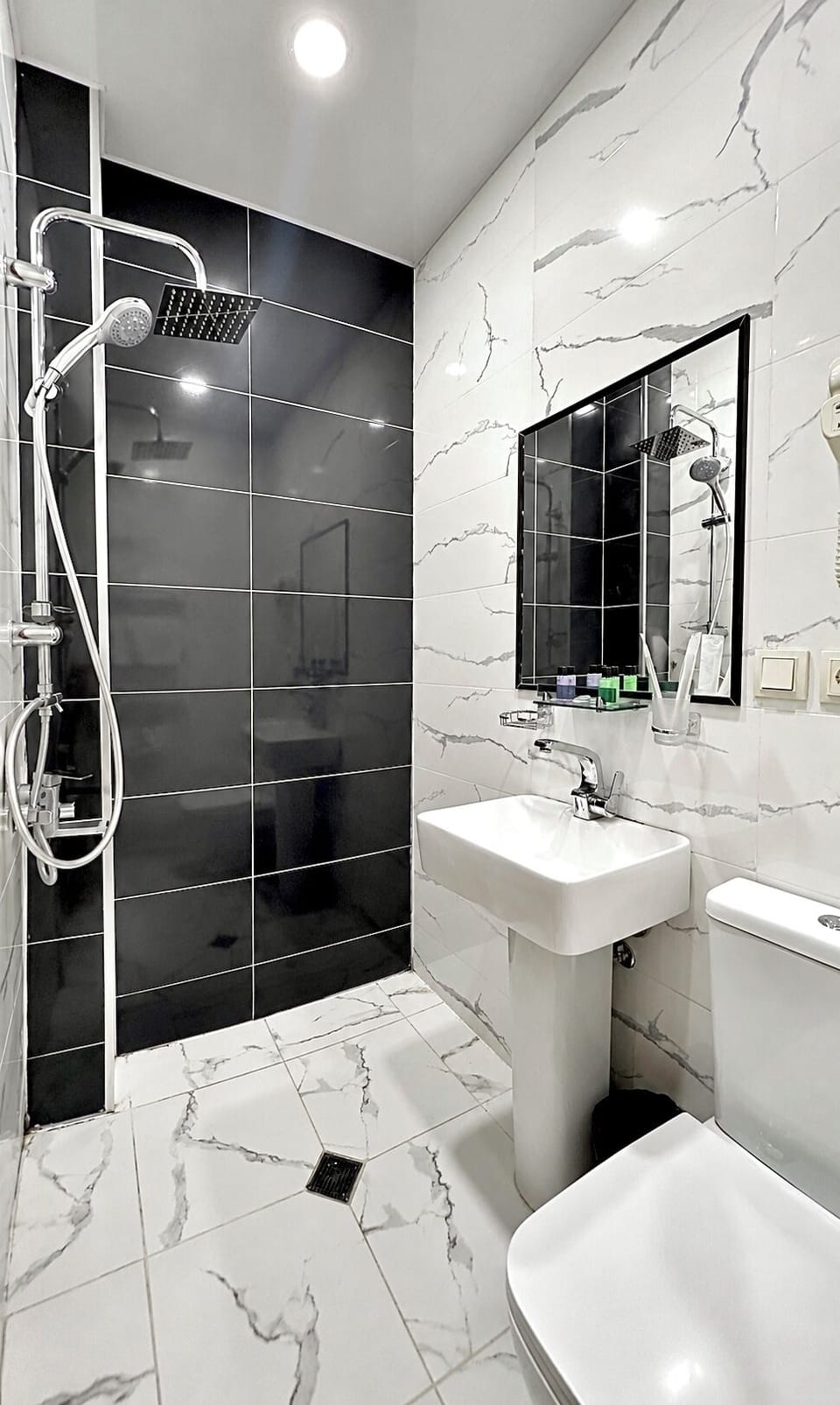 Shower, free toiletries, hair dryer, slippers