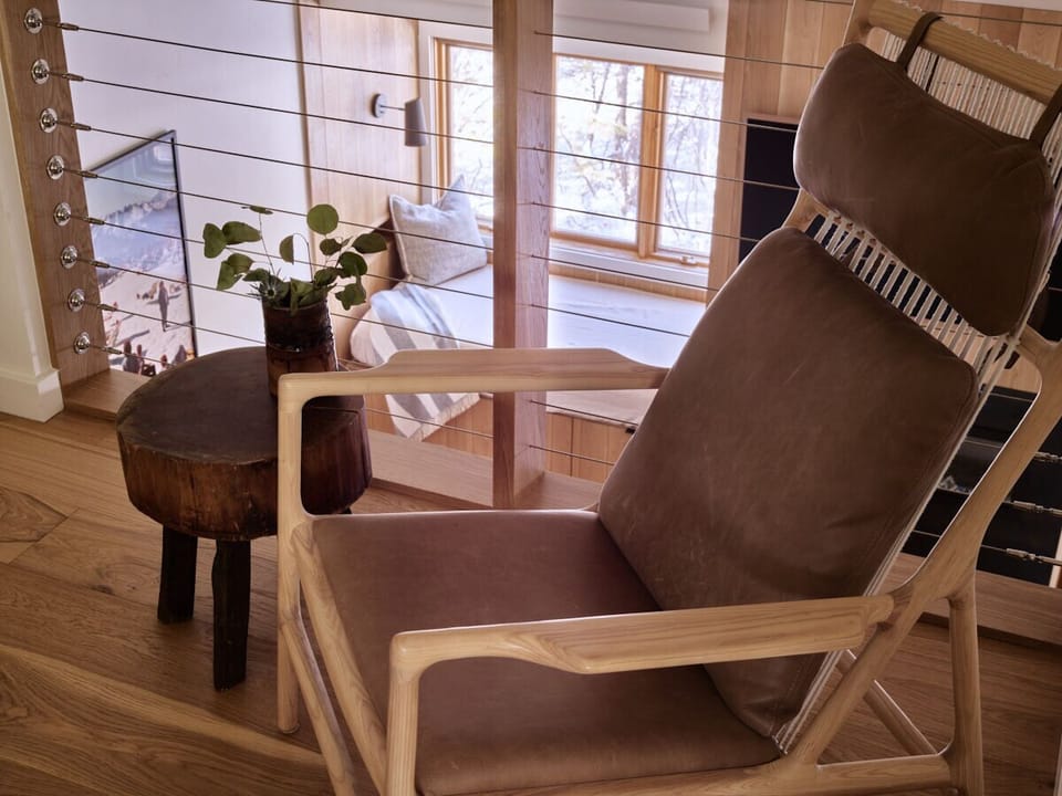 Primary Bedroom overlooking Living Area - A privacy shade has been installed in the overlook window, but does not prevent noise transfer.