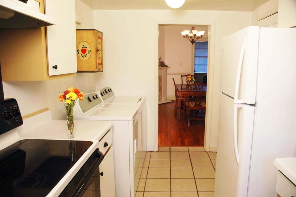 Easy laundry with washer/dryer, cabinets, laundry detergent.