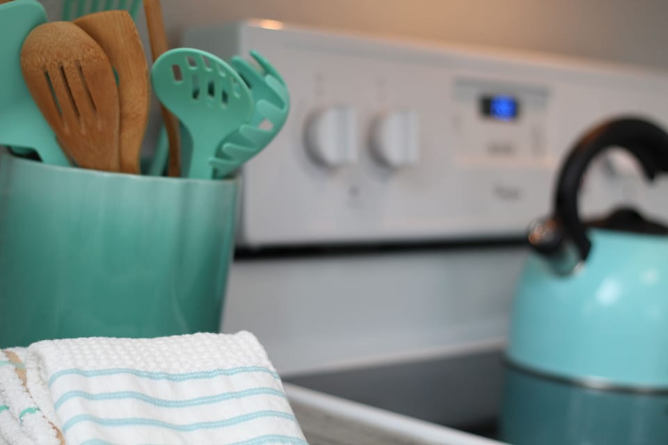 Coastal colors throughout. Kitchen Utensils & Sharper Image Tea Kettle.