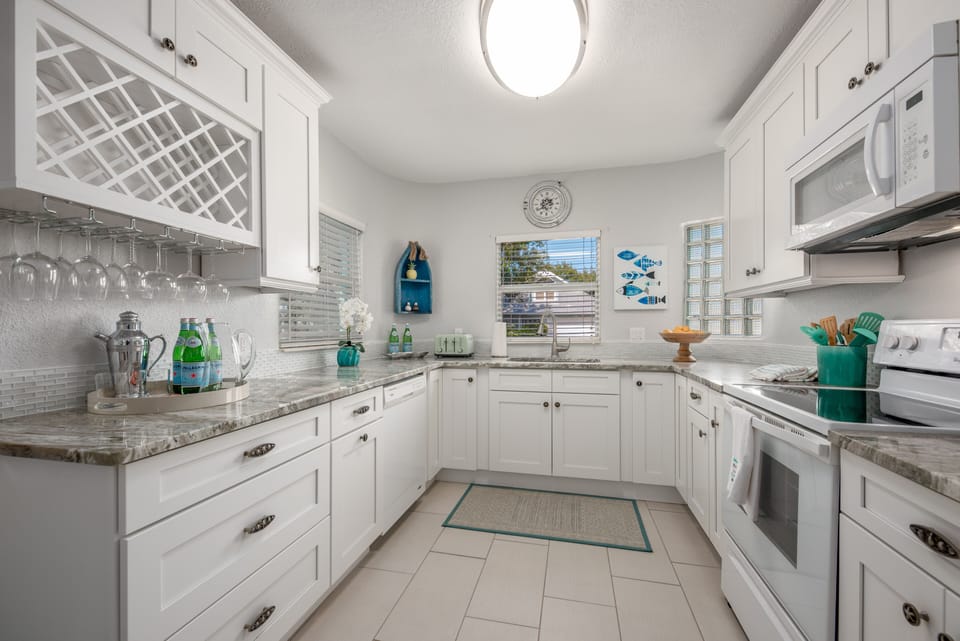 Renovated kitchen w/quartzite counters & new Shaker cabinets/drawers.