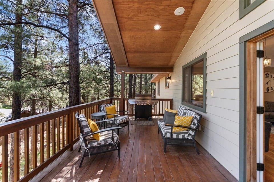 Deck off main floor: grill, seating, outdoor dining table