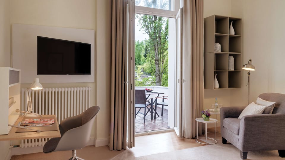 Hypo-allergenic bedding, desk, blackout drapes, iron/ironing board