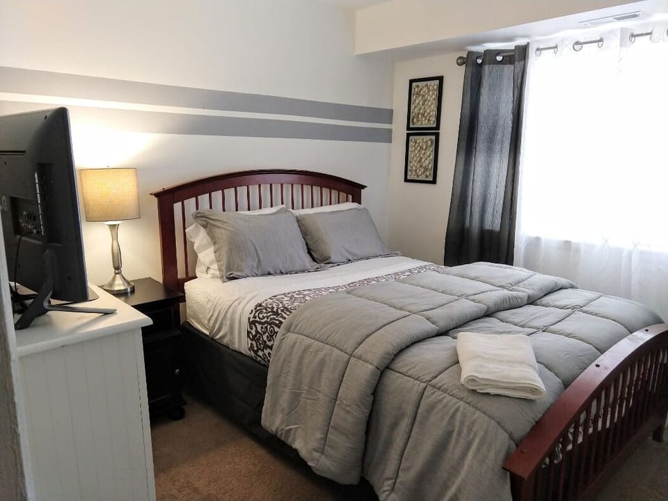 Second bedroom with sure. bed and tv