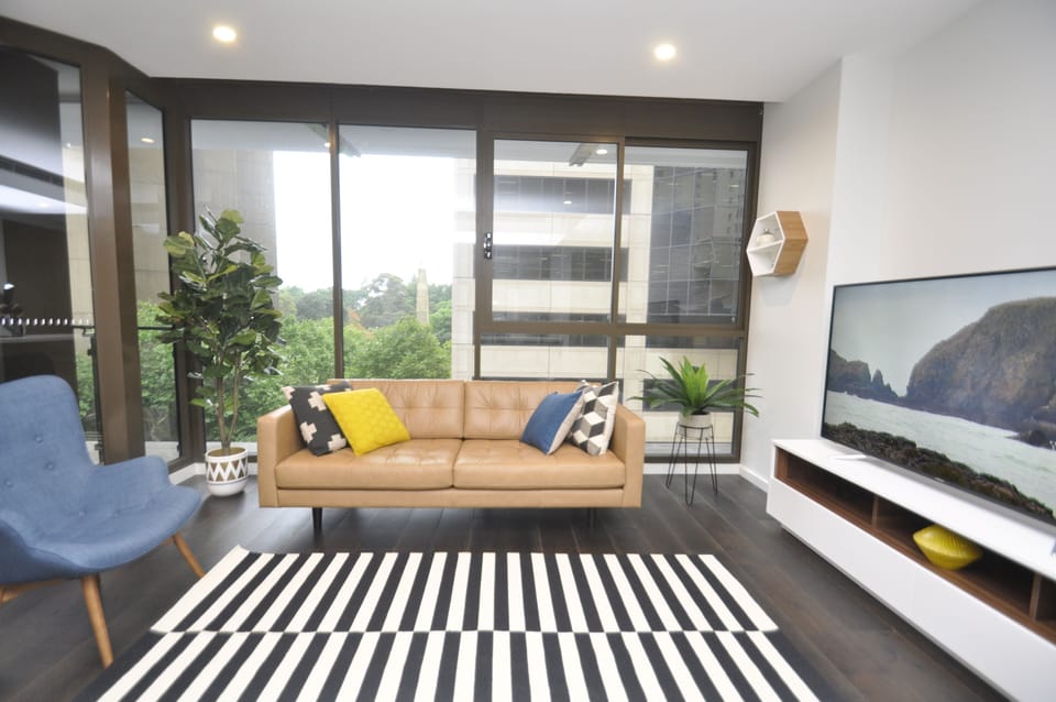 City Apartment | Living area | 55-inch flat-screen TV with digital channels, LCD TV