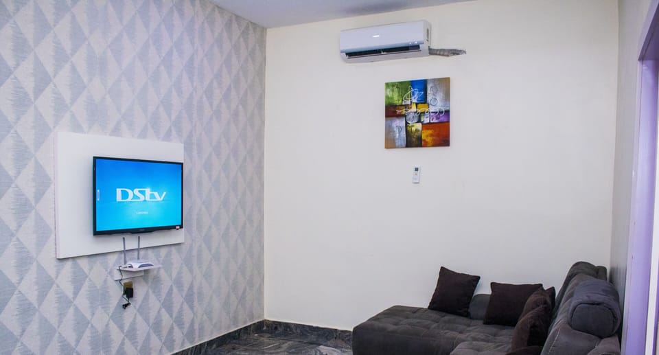 Luxury Apartment | Living room | 32-inch flat-screen TV with satellite channels, TV