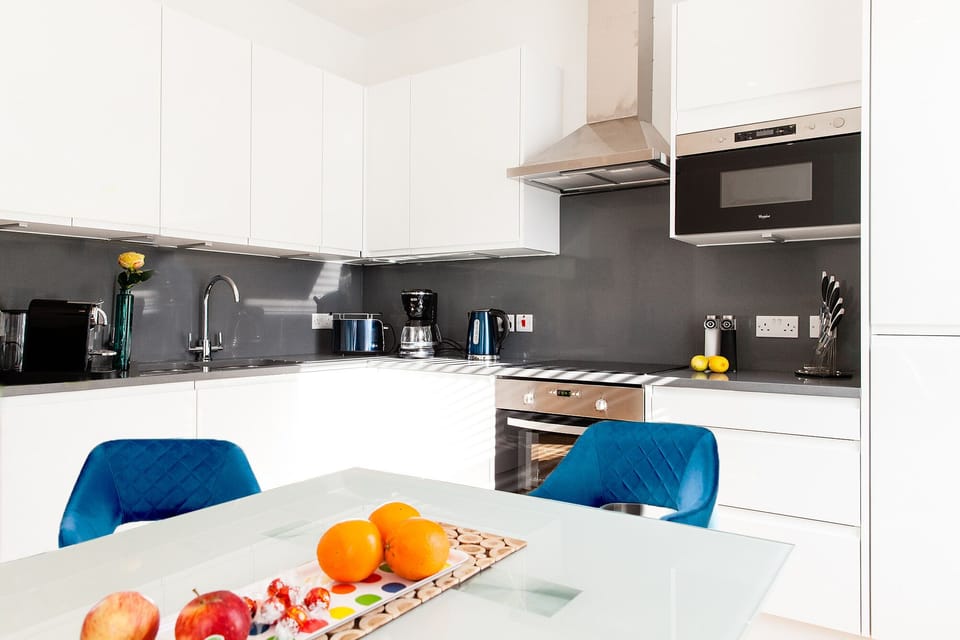 Duplex Apartment | Private kitchen | Coffee/tea maker, full-size fridge, microwave, oven