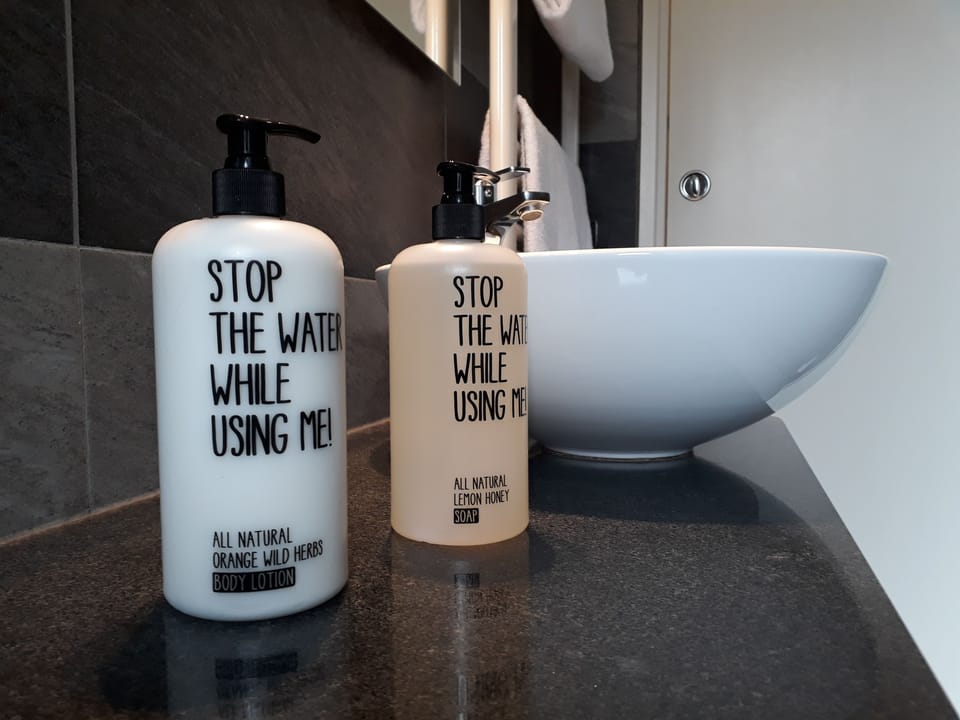 Shower, rainfall showerhead, eco-friendly toiletries, hair dryer