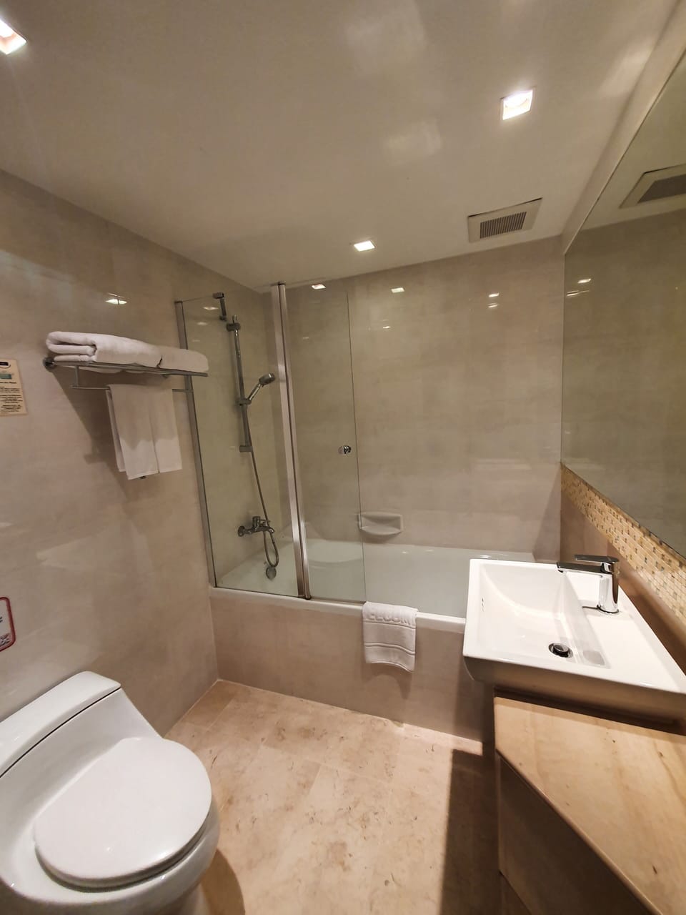 Combined shower/tub, free toiletries, hair dryer, slippers