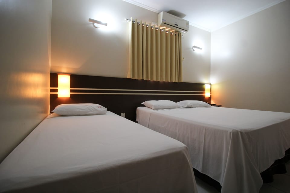 Deluxe Triple Room | Minibar, desk, WiFi (free), bed sheets