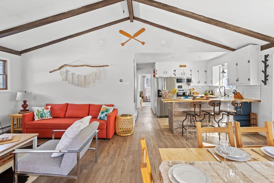 High ceilings, modern furnishings, and a cozy atmosphere will greet you in the main living space.