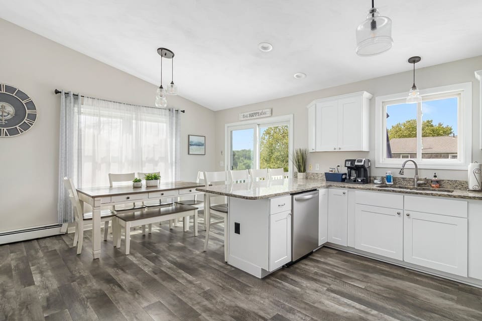 Kitchen open to Dining area with Slider to Elevated Deck.
