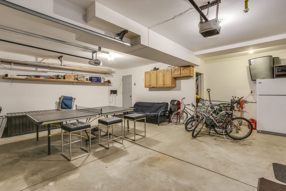 Attached garage with ping pong, bikes for riding, futon and xtra fridge/freezer