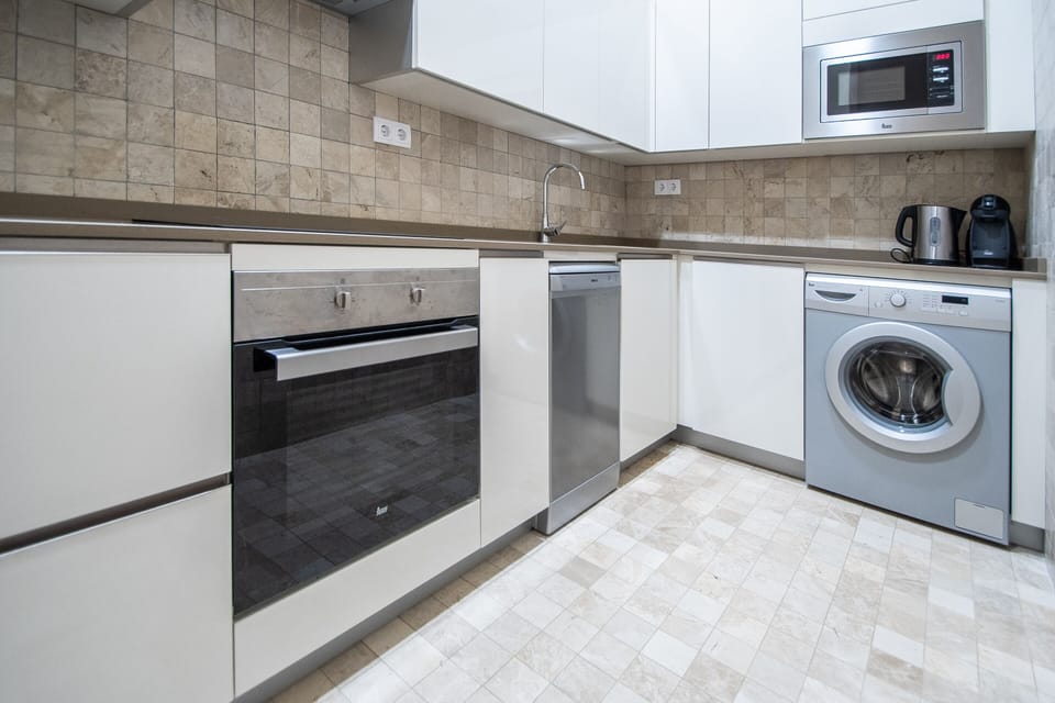 Deluxe Apartment | Private kitchen | Coffee/tea maker, full-size fridge, microwave, oven