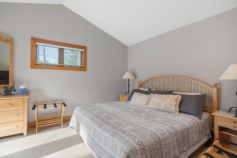 Master bedroom - The master bedroom faces the Boyneland run with a doorwall to enjoy the beautiful green landscape or a snowy scene.  King bed with dresser and closet.  Full en suite master bathroom with jacuzzi tub.