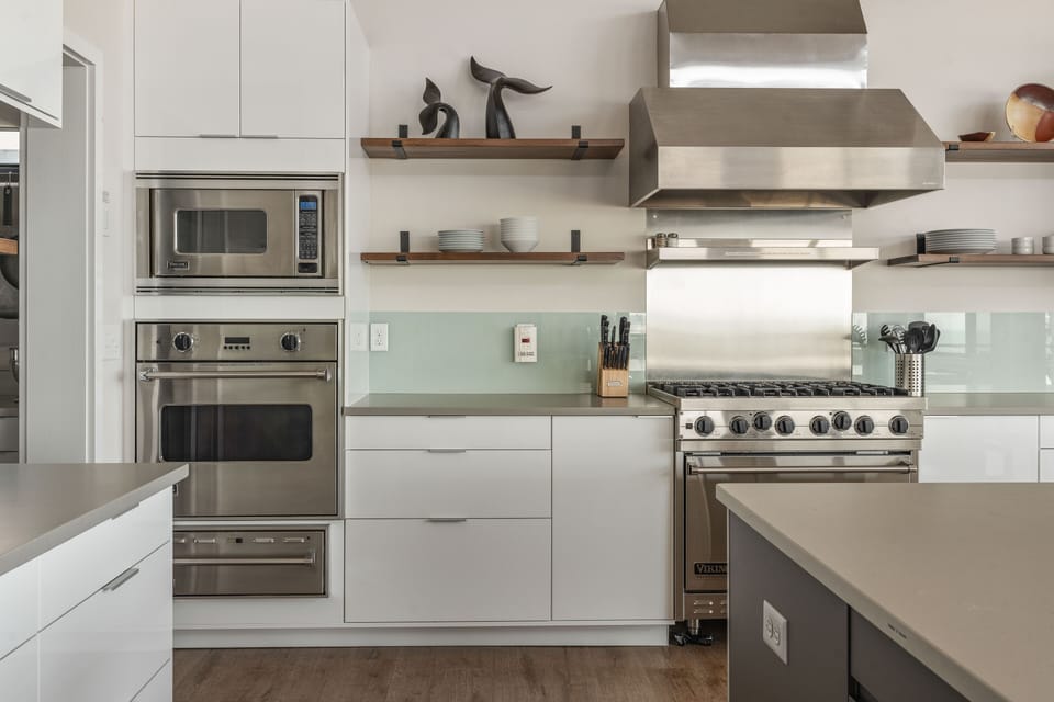 Viking appliances; microwave, wall oven, & warming oven on left.