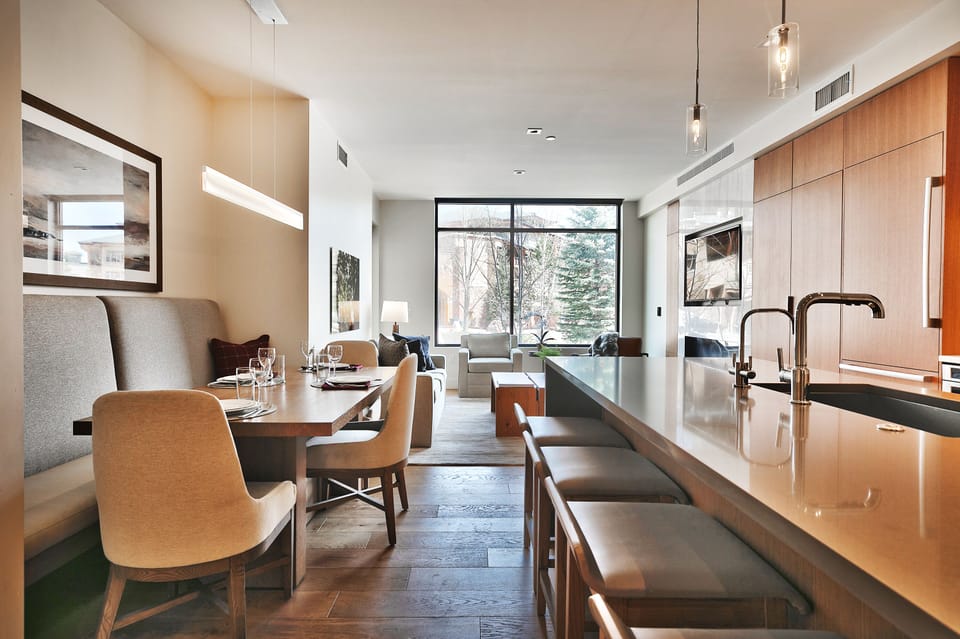 Striking kitchen island and dining nook for seating for 10