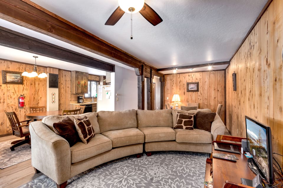 The inviting living room, featuring a warm fireplace and rustic charm.
